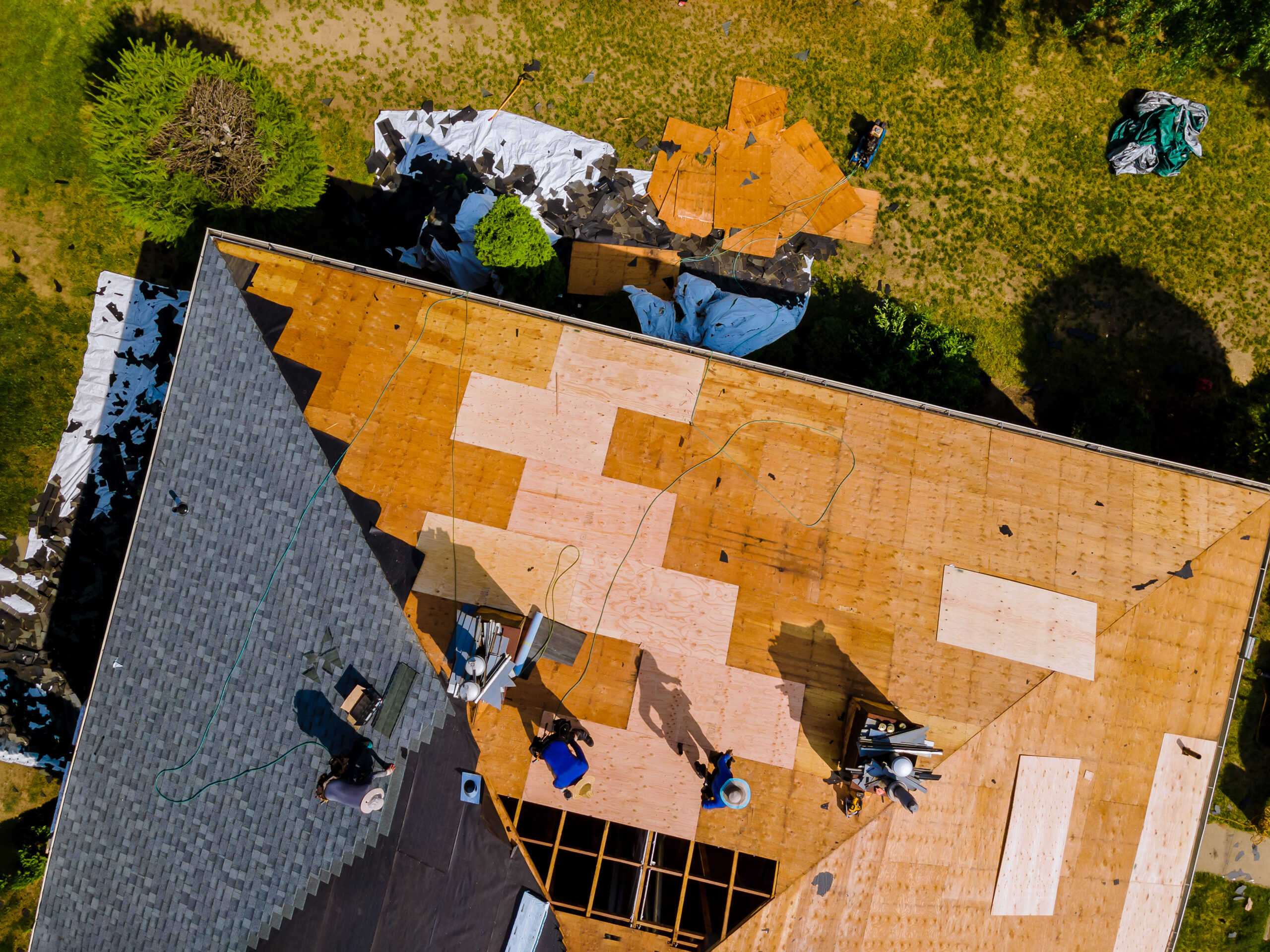 aerial view roof construction repairman residential apartment with new roof scaled